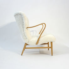 Load image into Gallery viewer, Swedish sheepskin lounge chair, attr. to Erik Bertil Karlén, 1940s