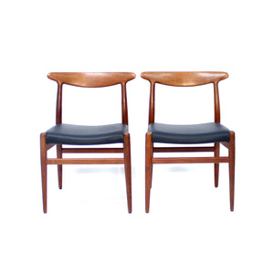 Hans Wegner, pair of Teak and leather dining chairs, model W2 for C.M. Madsen, 1960s