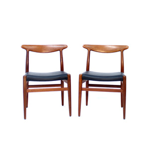 Hans Wegner, pair of Teak and leather dining chairs, model W2 for C.M. Madsen, 1960s