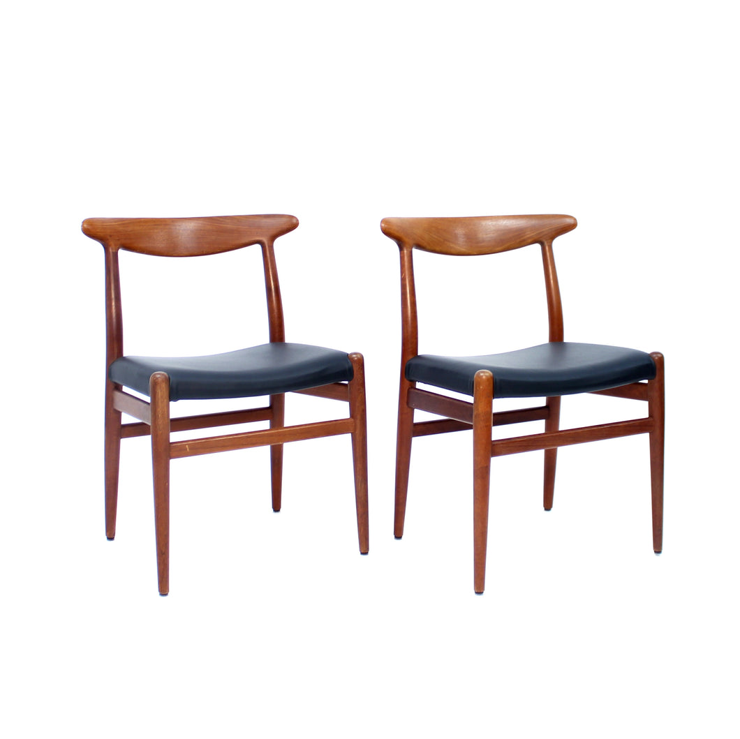Hans Wegner, pair of Teak and leather dining chairs, model W2 for C.M. Madsen, 1960s