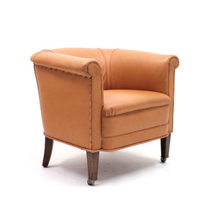 Brown leather club chair on castors, 1930s