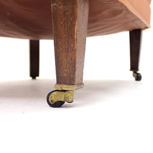 Brown leather club chair on castors, 1930s