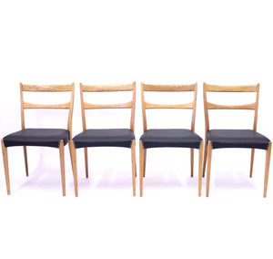 Scandinavian oak dining chairs with black leather seats, 1950s