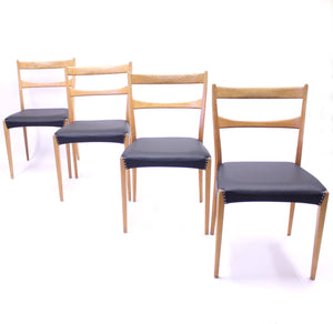 Scandinavian oak dining chairs with black leather seats, 1950s
