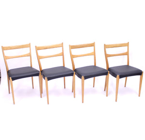 Scandinavian oak dining chairs with black leather seats, 1950s