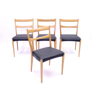 Scandinavian oak dining chairs with black leather seats, 1950s