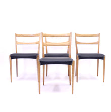 Load image into Gallery viewer, Scandinavian oak dining chairs with black leather seats, 1950s