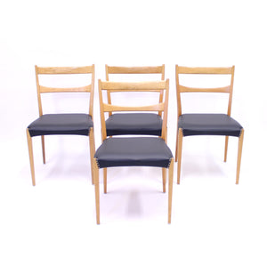 Scandinavian oak dining chairs with black leather seats, 1950s