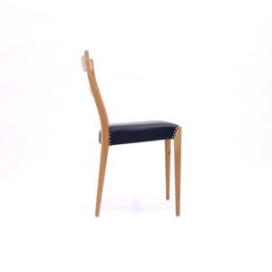 Scandinavian oak dining chairs with black leather seats, 1950s