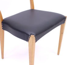 Load image into Gallery viewer, Scandinavian oak dining chairs with black leather seats, 1950s