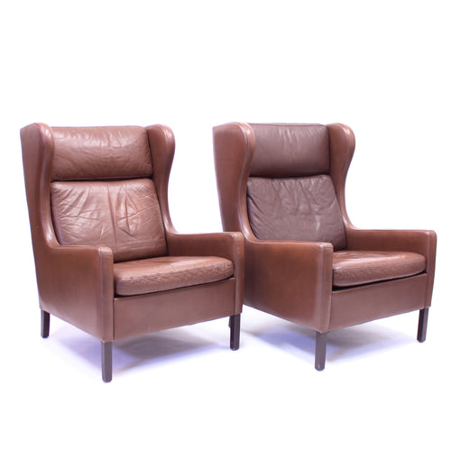 Pair of Scandinavian leather wingback chairs, attributed to Stouby, 1970s