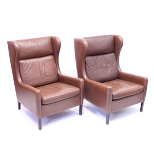 Pair of Scandinavian leather wingback chairs, attributed to Stouby, 1970s