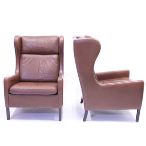 Pair of Scandinavian leather wingback chairs, attributed to Stouby, 1970s