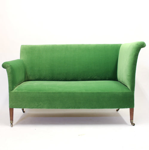 Asymmetric antique sofa on castors, ca 1900