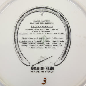 Pair of Fornasetti Grand Campioni plates, second half of 20th century
