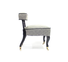 Load image into Gallery viewer, Diminutive antique ebonized reading chair on castors, late 19th century